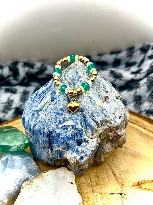 Green onyx and Opal with gold plated silver beads and heart and sterling silver. Stretchy Ring available in small, medium and large.