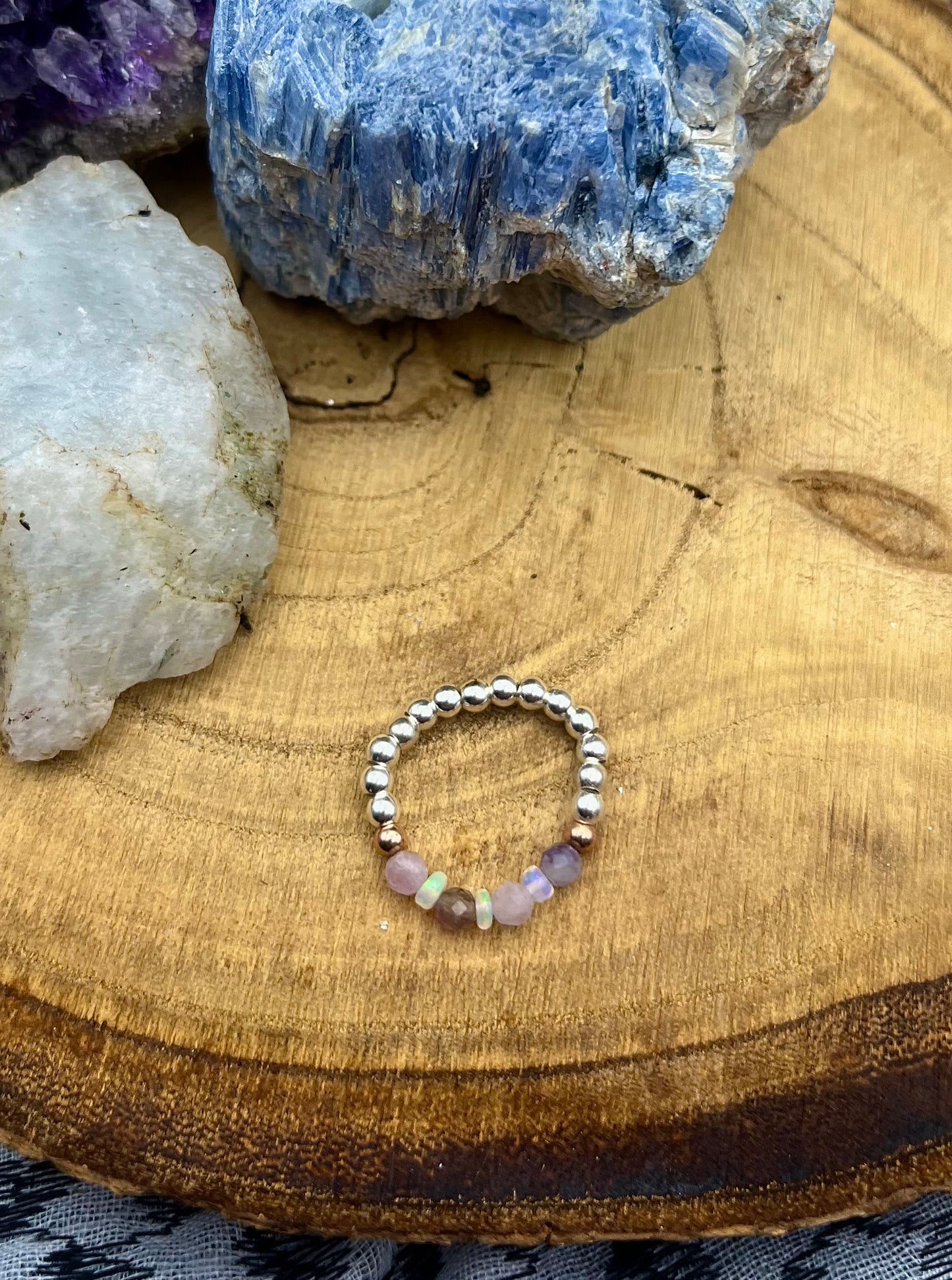 Pink Tournaline, Kunzite and Opal. Sterling silver stretch ring with solid rose gold accents.