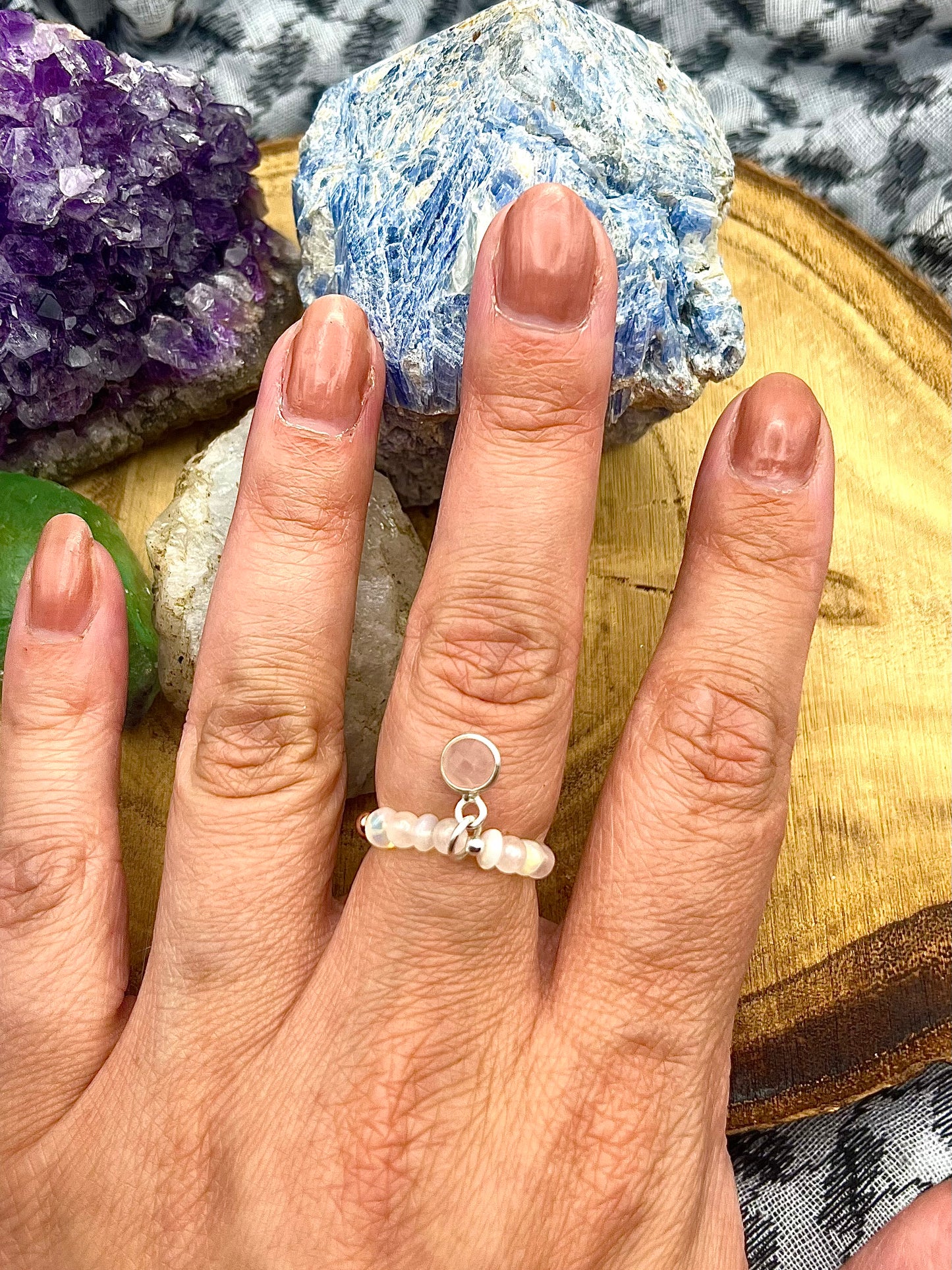 Opal and Rose Quartz with rose quartz charm. Sterling silver stretch ring with solid rose gold accents.
