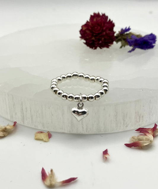Sterling silver heart charm and stretch ring.