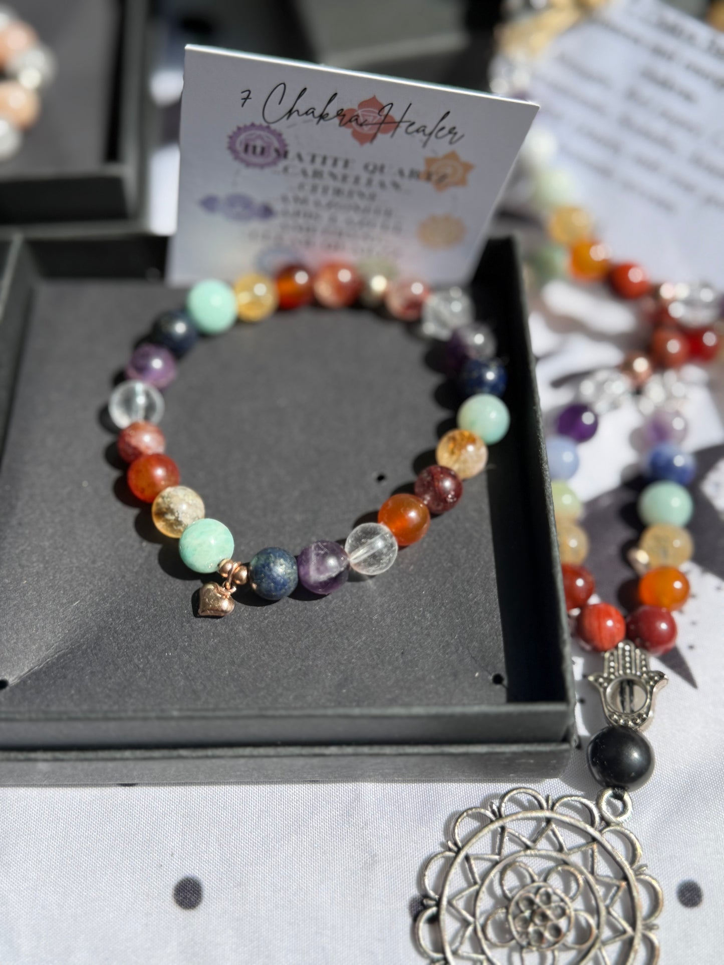 Handmade 7 Chakra stretch bracelet. 8mm Premium Crystal beads with sterling silver.