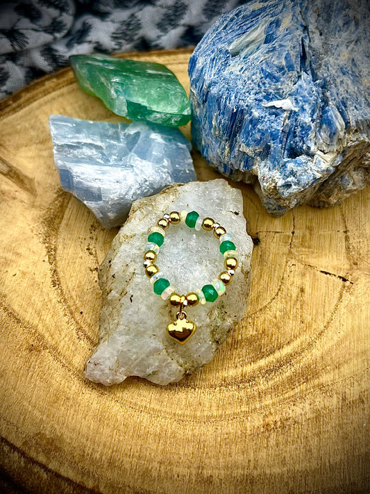 Green onyx and Opal with gold plated silver beads and heart and sterling silver. Stretchy Ring available in small, medium and large.