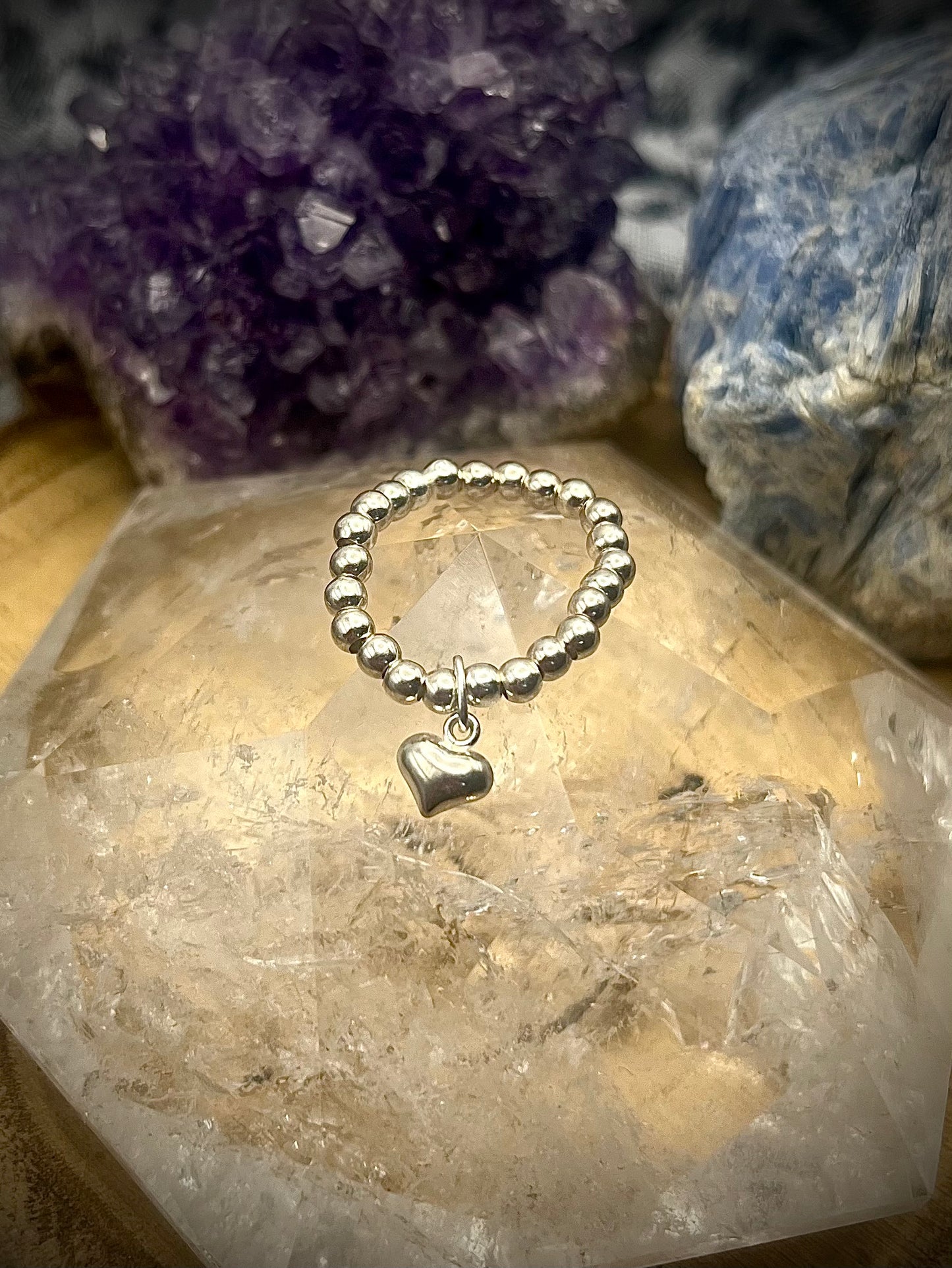 Sterling silver heart charm and stretch ring.