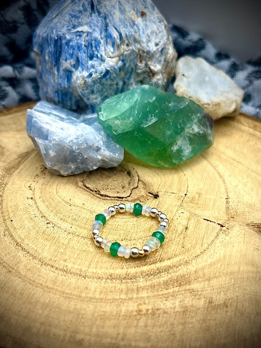 Green onyx and Opal with gold plated silver and sterling silver. Stretchy Ring available in small, medium and large.