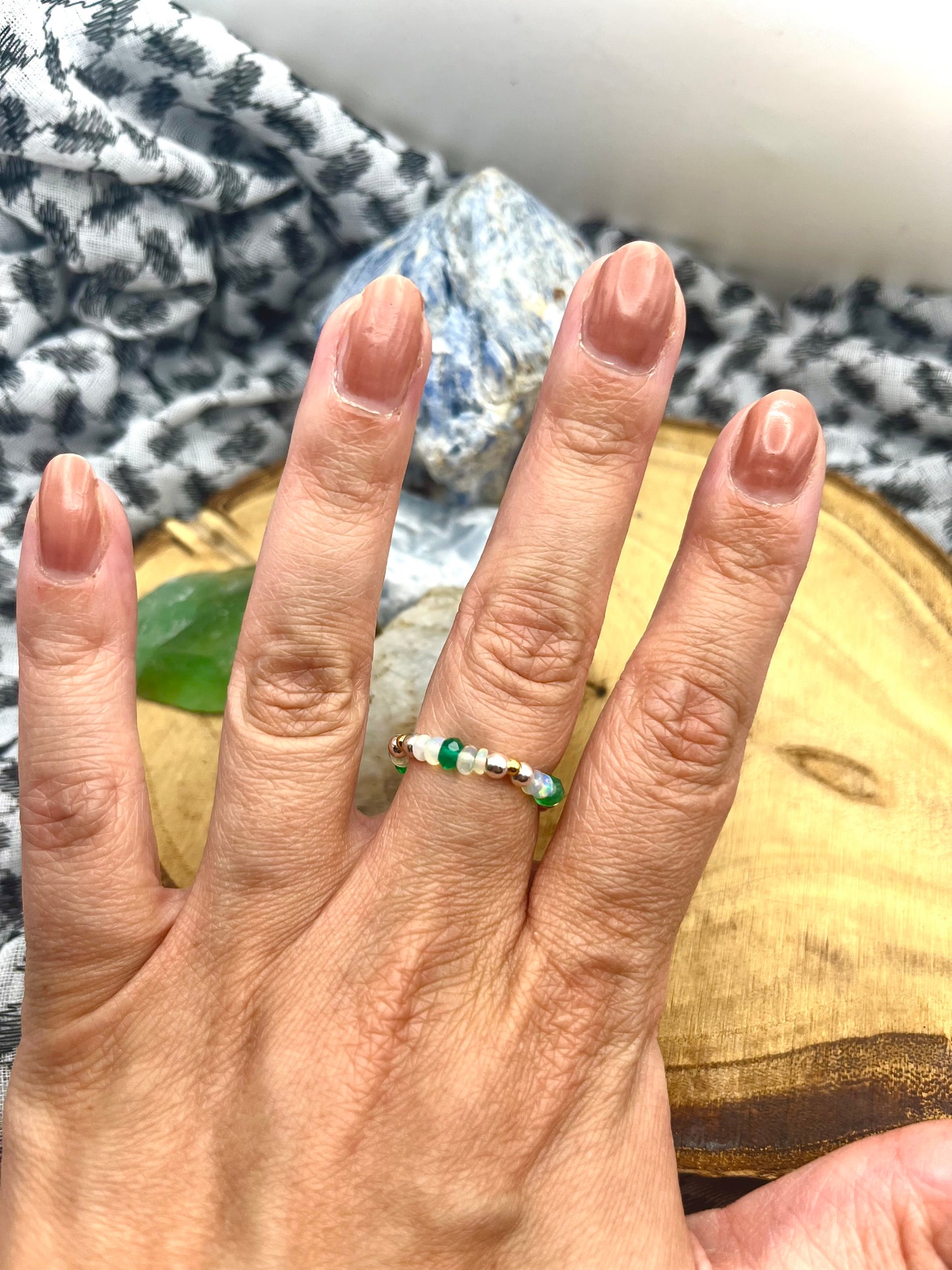 Green onyx and Opal with gold plated silver and sterling silver. Stretchy Ring available in small, medium and large.