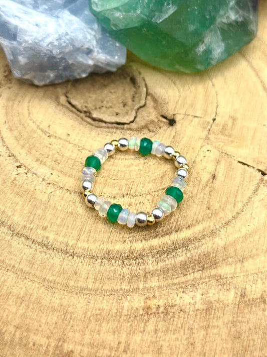 Green onyx and Opal with gold plated silver and sterling silver. Stretchy Ring available in small, medium and large.