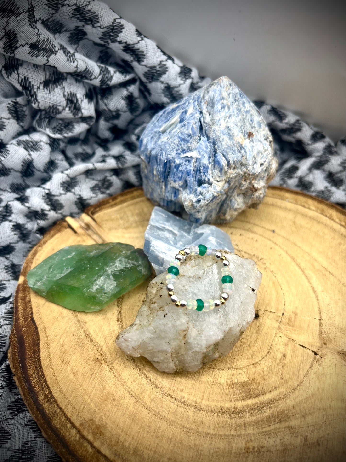 Green onyx and Opal with gold plated silver and sterling silver. Stretchy Ring available in small, medium and large.
