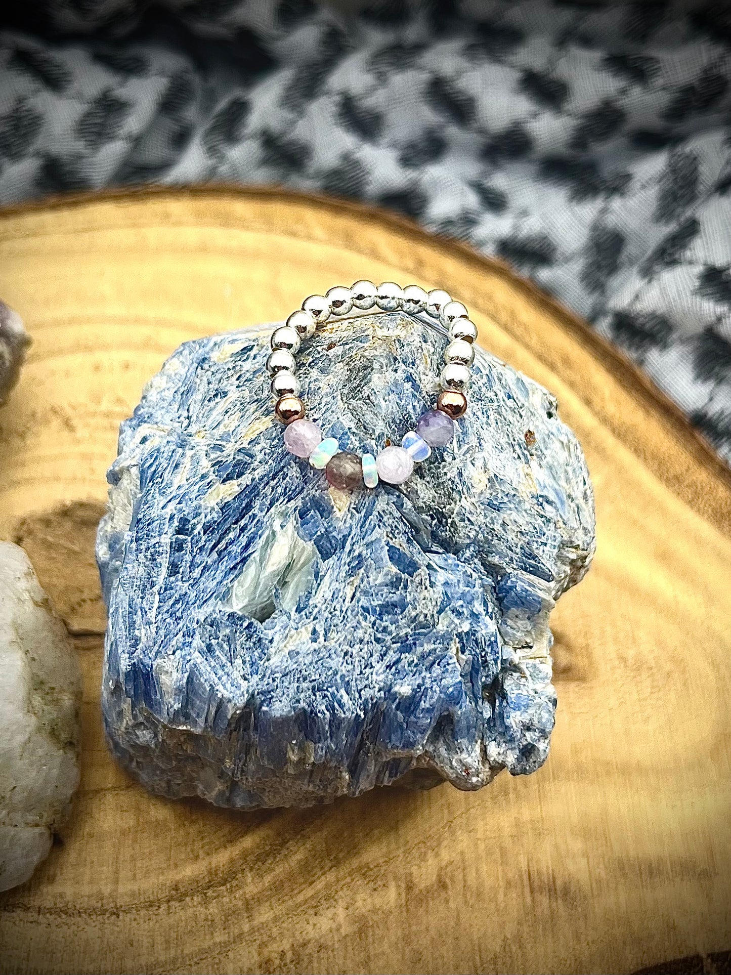 Pink Tournaline, Kunzite and Opal. Sterling silver stretch ring with solid rose gold accents.