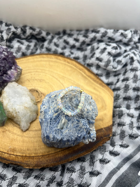 Opal and Sterling silver / gold plated stretch ring.