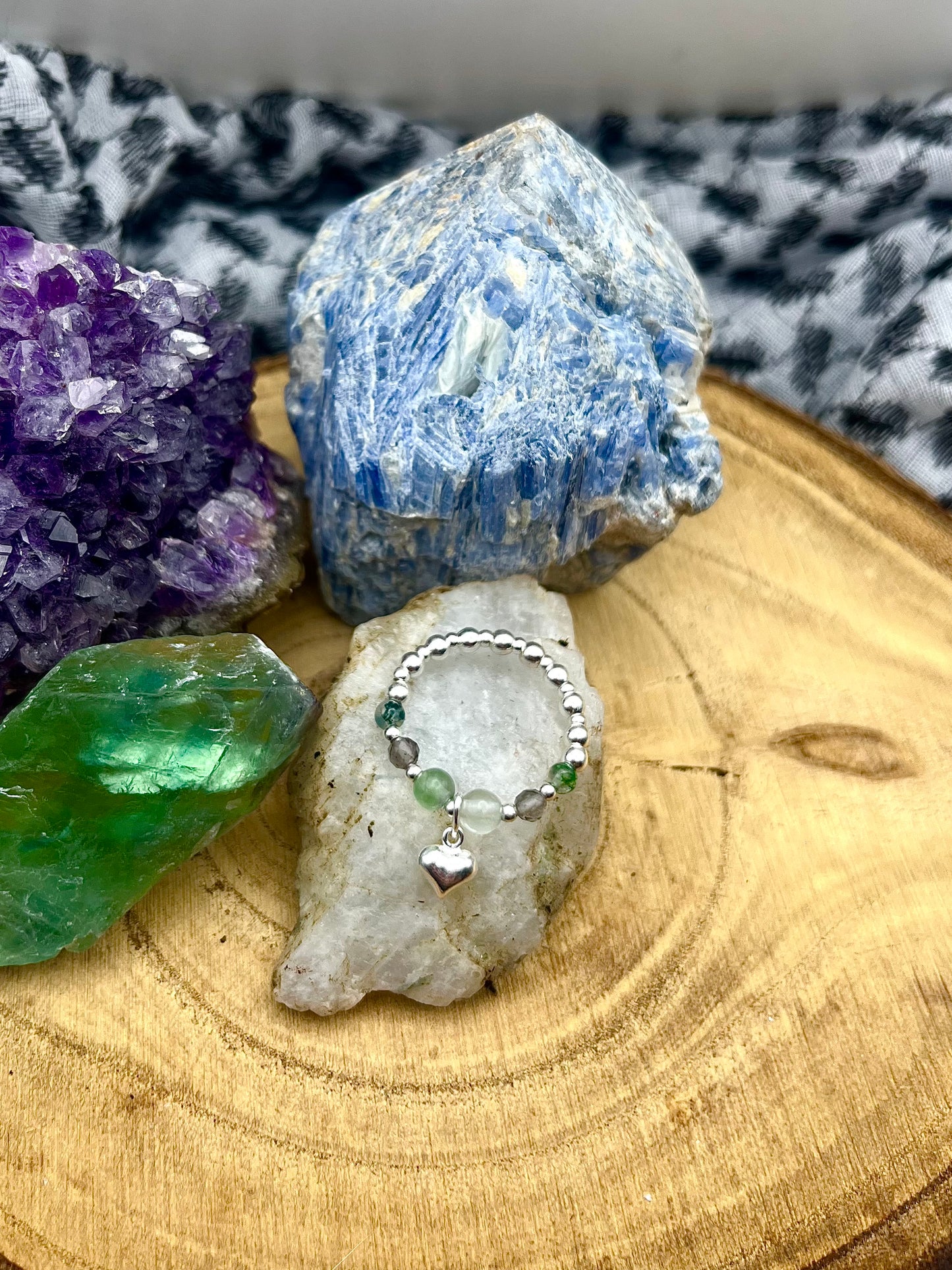 Fluorite, Smoky Quartz, Moss Agate. Sterling silver stretch ring with heart charm.