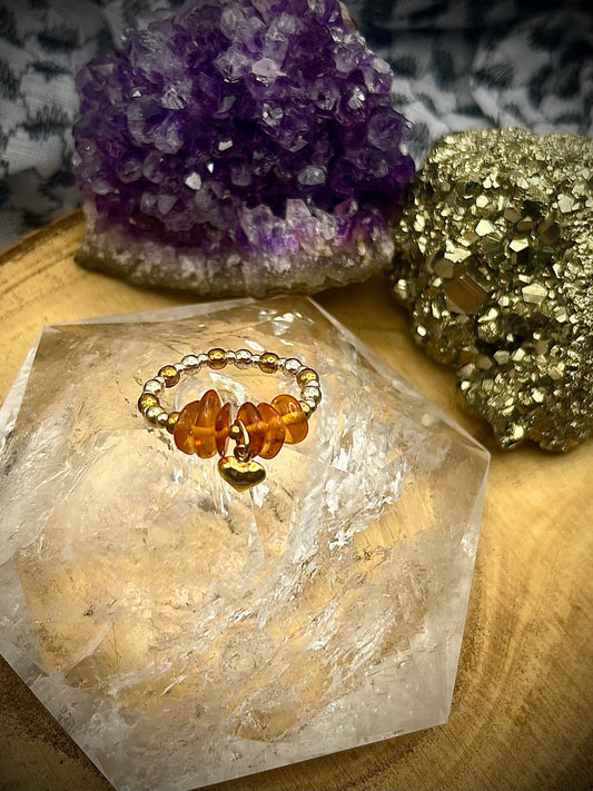 Genuine Amber with Gold Vermeil and Sterling silver. One of a kind Stretch ring available in 3 sizes.