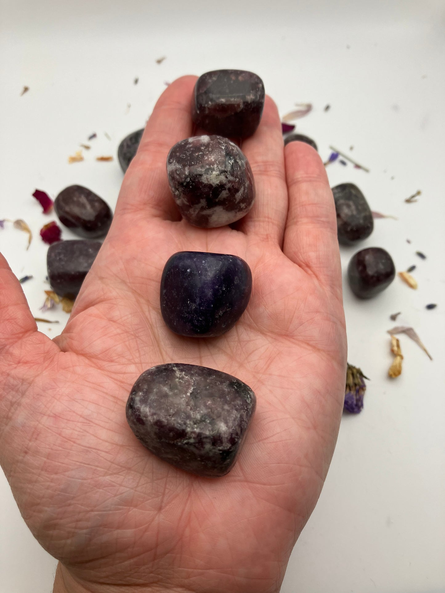 Dark purple lepidolite tumble stones