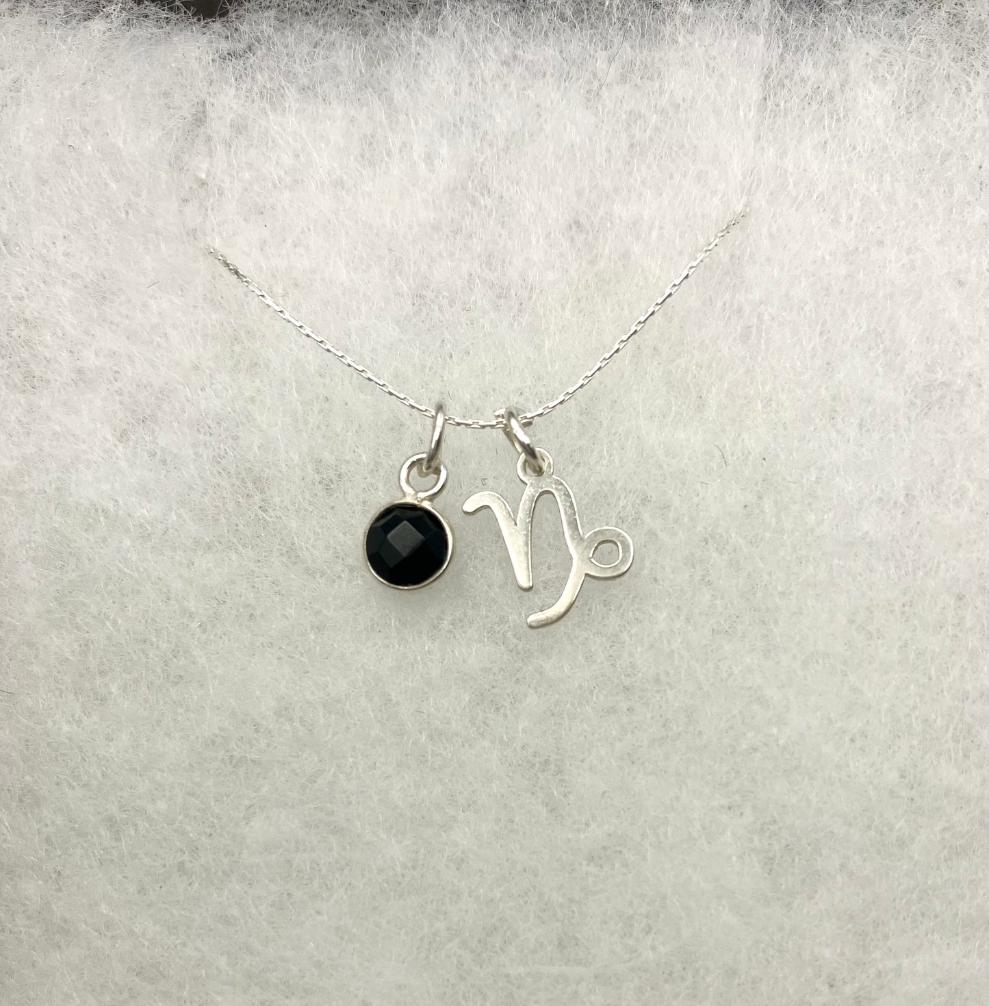 Sterling Silver Capricorn Necklace with black onyx gem charm.