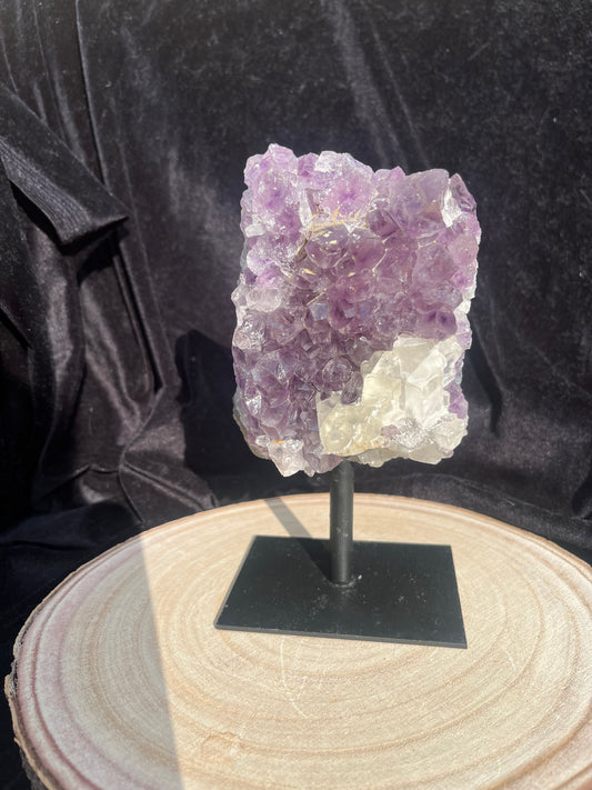 A grade Amethyst cluster on stand with calcite (attached). 0.97 kg