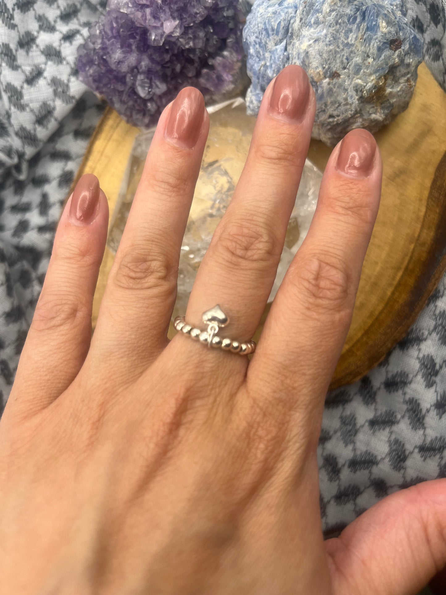 Sterling silver heart charm and stretch ring.
