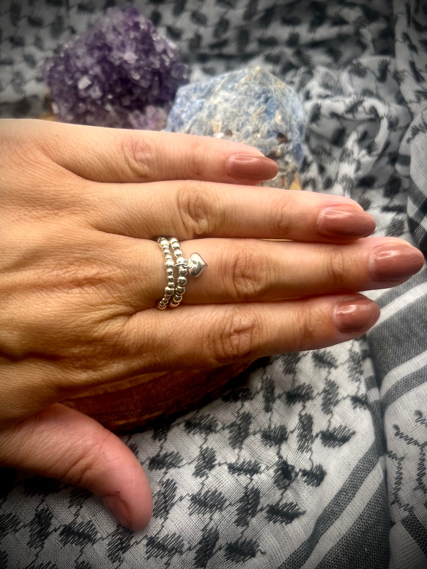 Sterling silver heart charm and stretch ring.