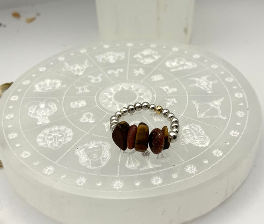 Sacral chakra - goldsone and tigers eye with silver coloured iron beads.