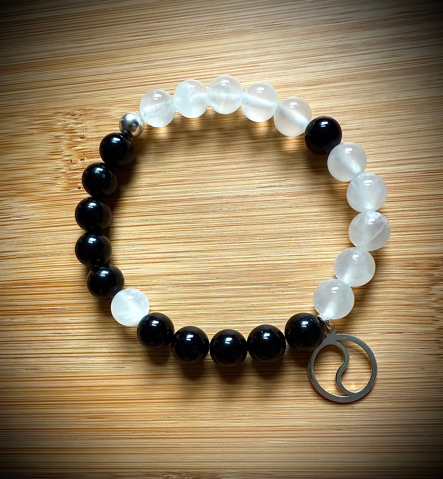 Handmade Yin Yang ☯️ stretch bracelet. 8mm Satin Spar and Tourmaline beads with sterling silver.