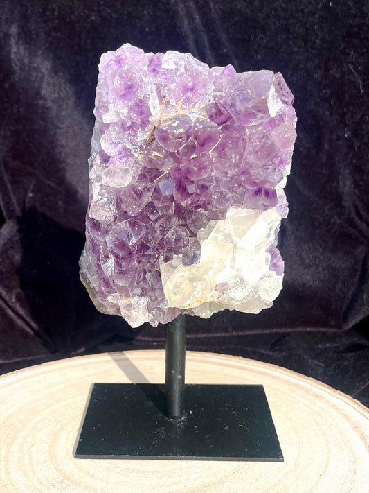 A grade Amethyst cluster on stand with calcite (attached). 0.97 kg