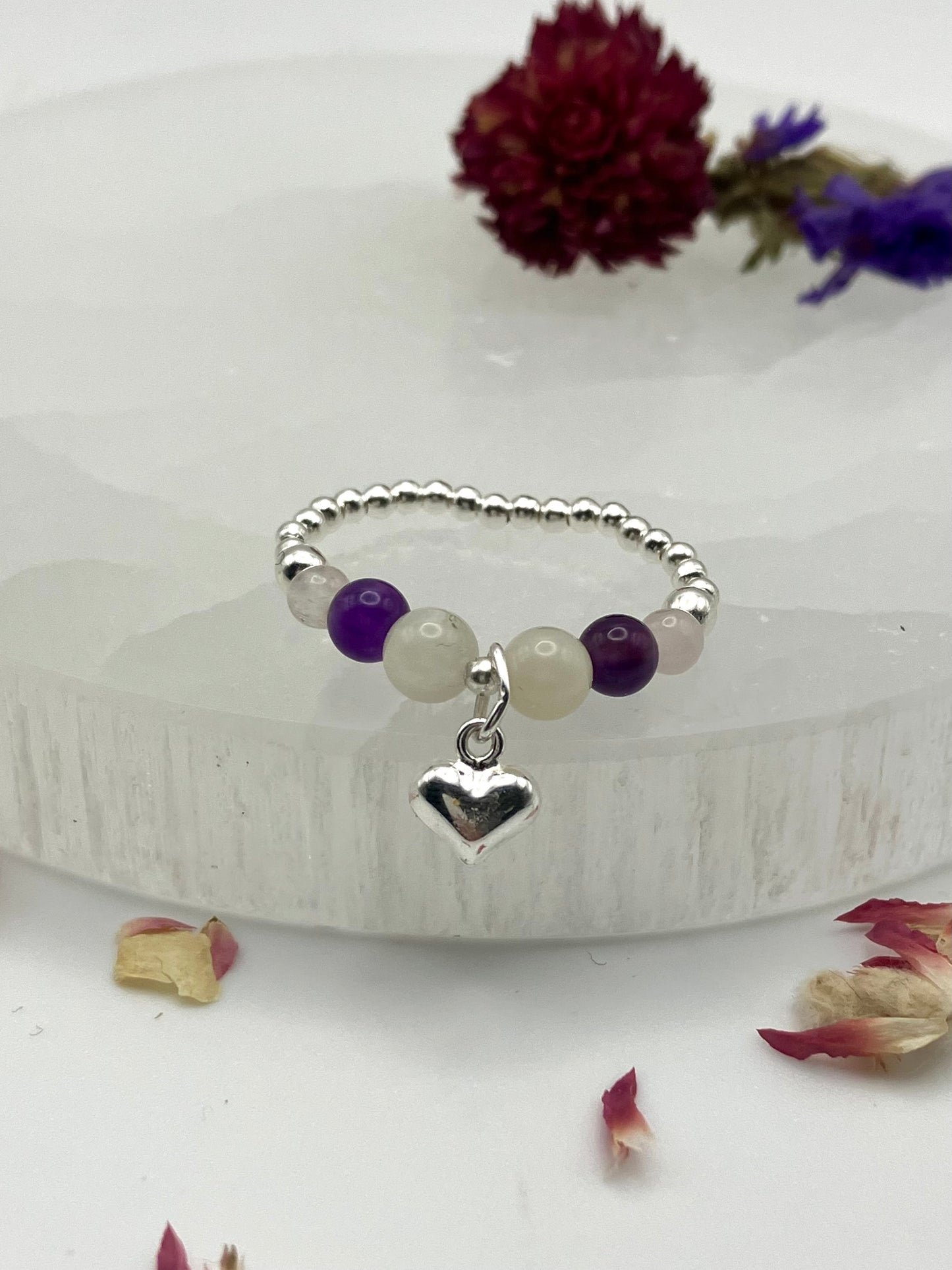 ‘Crystal hearts - patience and calm’ Sterling silver stretch ring. Moonstone, amethyst, rose quartz.