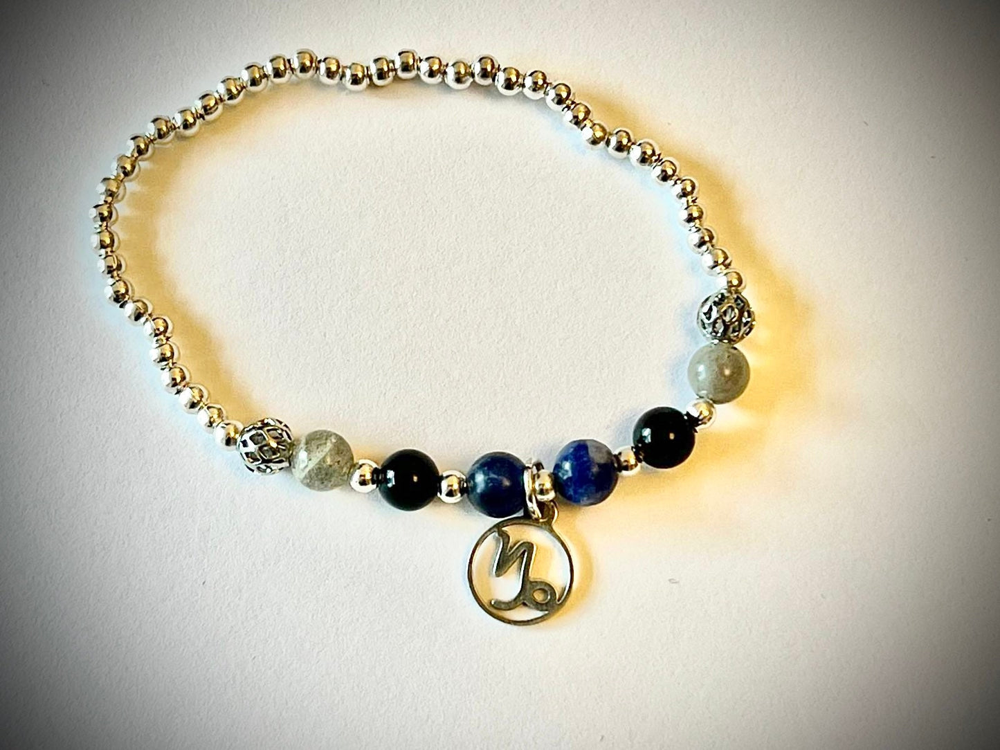 Capricorn charm birthstone bracelet. TWO OPTIONS. Labradorite, Sodalite, Black onyx. Zodiac birthday gift. Calming, grounding, thoughtful